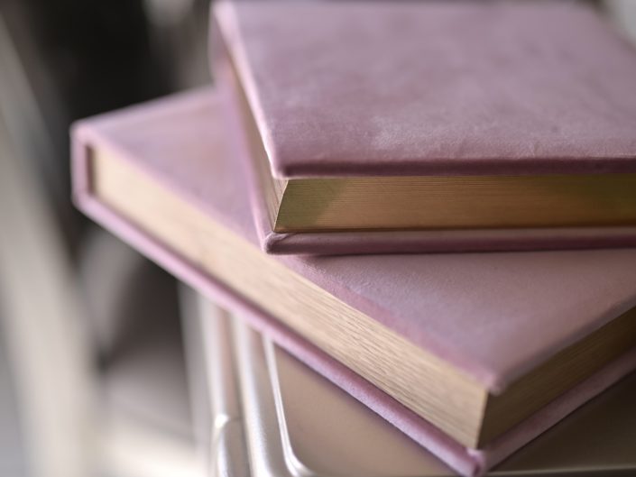 Pink velvet books with gold pages.